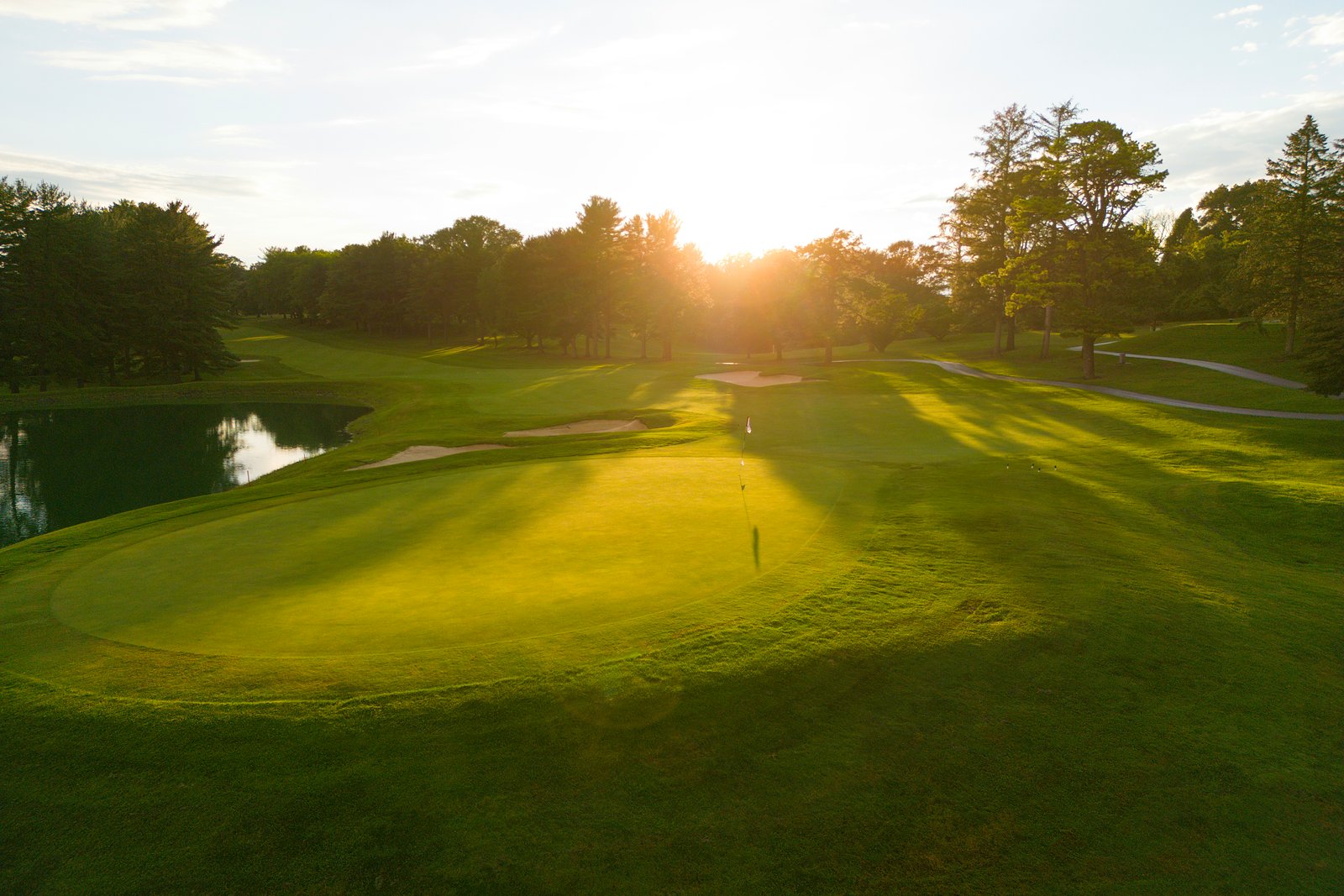 Cart Path Golf Club. The first tee at dawn, dew on the fairway.