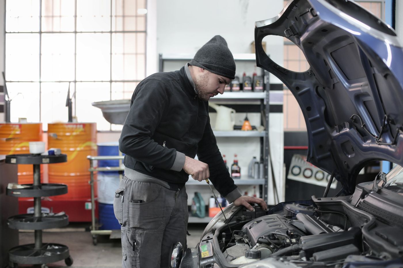 A mechanic at a workbench. Bay Two.