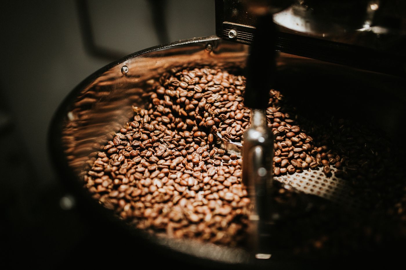 A cup of coffee and beans. First Crack.