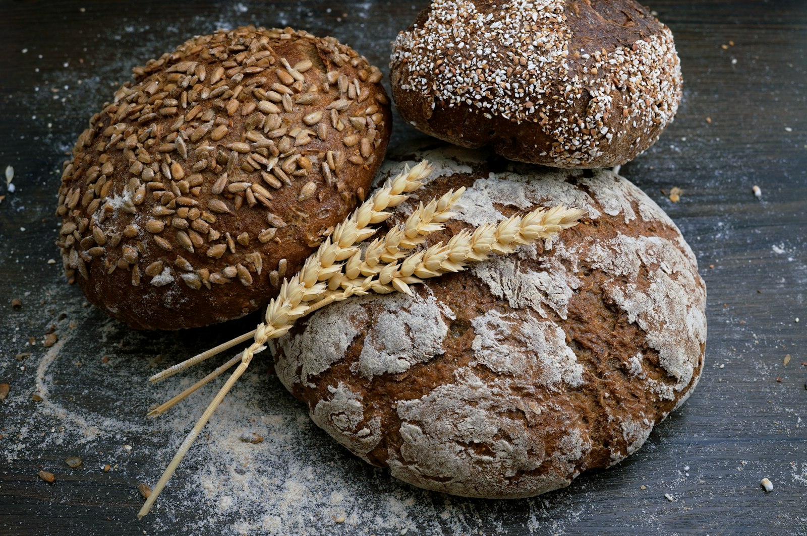 Late Light bakery. Dark loaves on a wooden table.