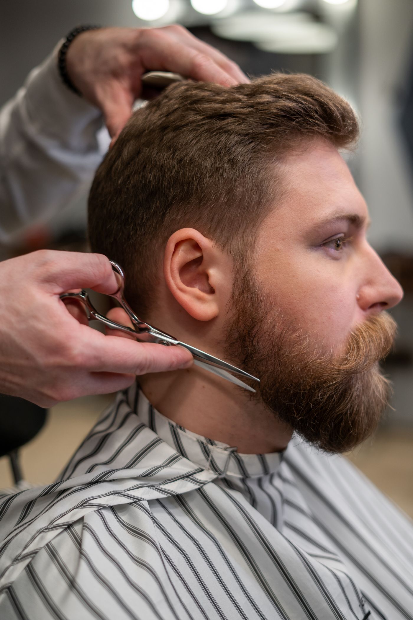 Clippers and a comb on a station. Open Chair.