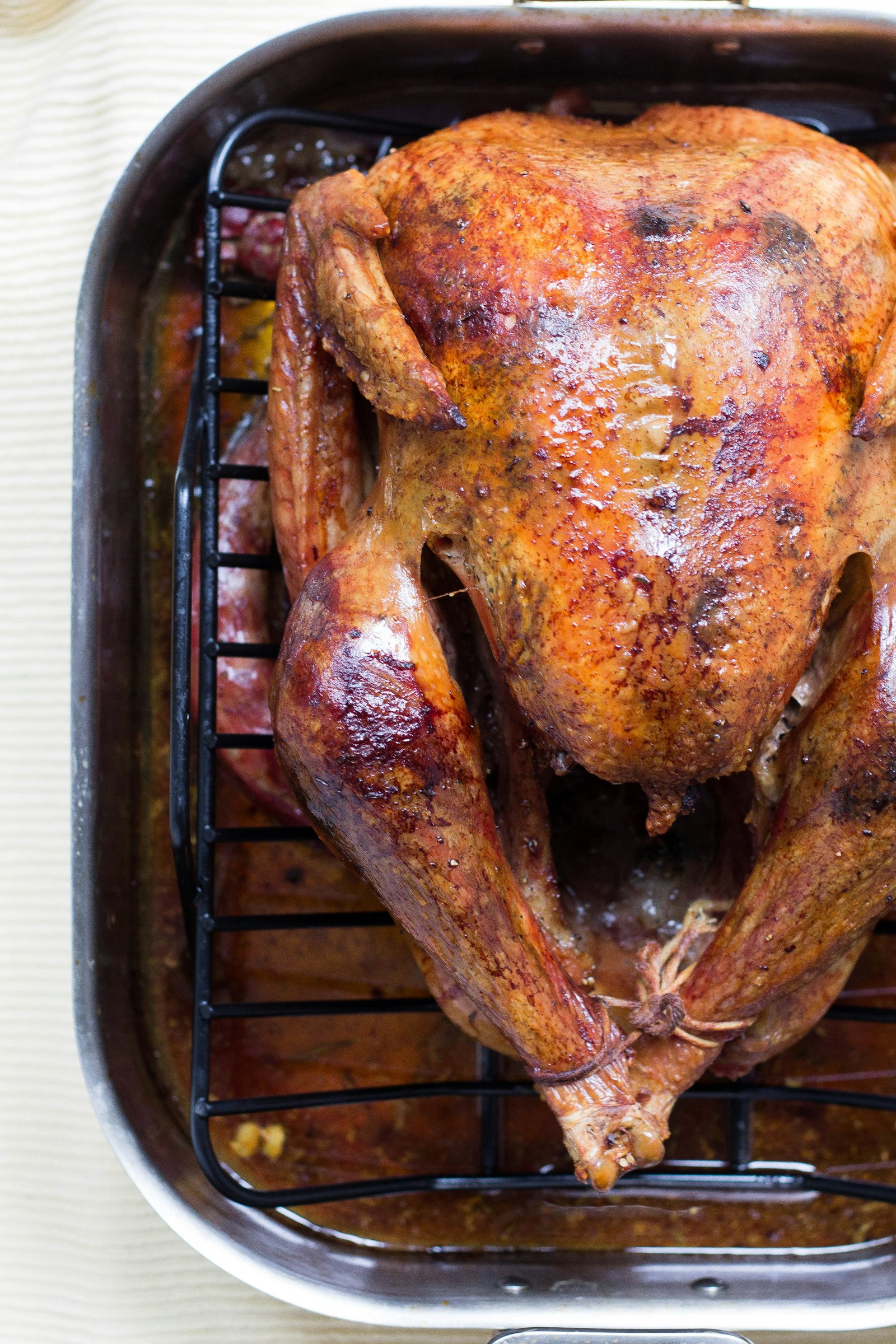 A roast bird in the pan, juices at the bottom. Redbird Supper.