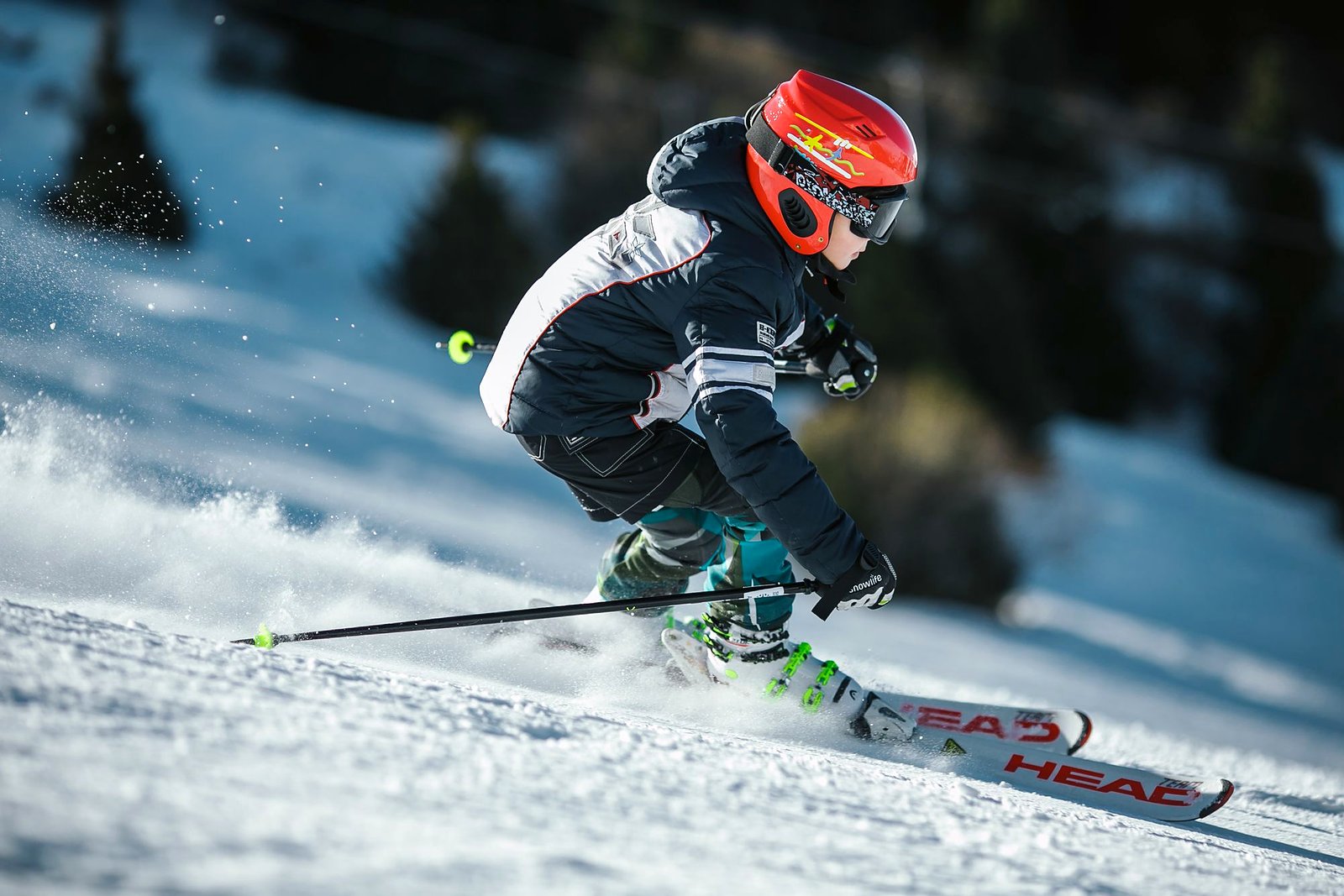 Skier carving hard with a spray of bright snow.